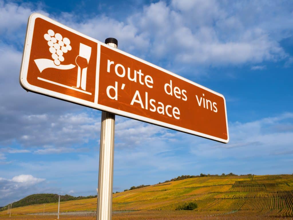 a sign and a symbol of route des vins in alsace, france. english translation: wine route of alsace