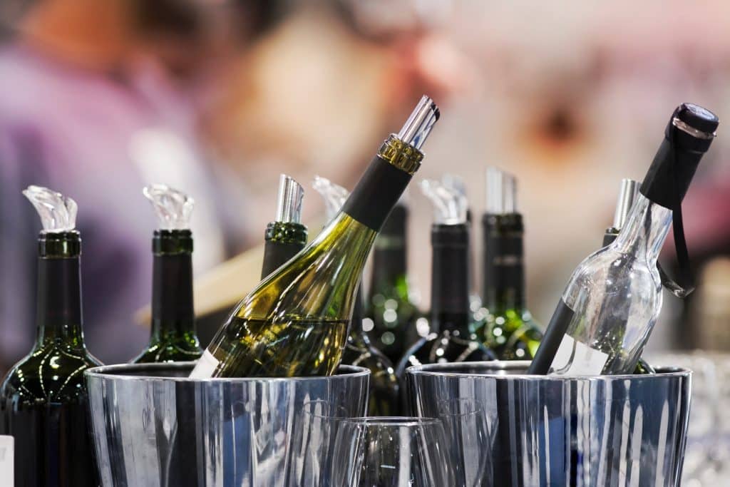 bottles of red wine in chromium buckets