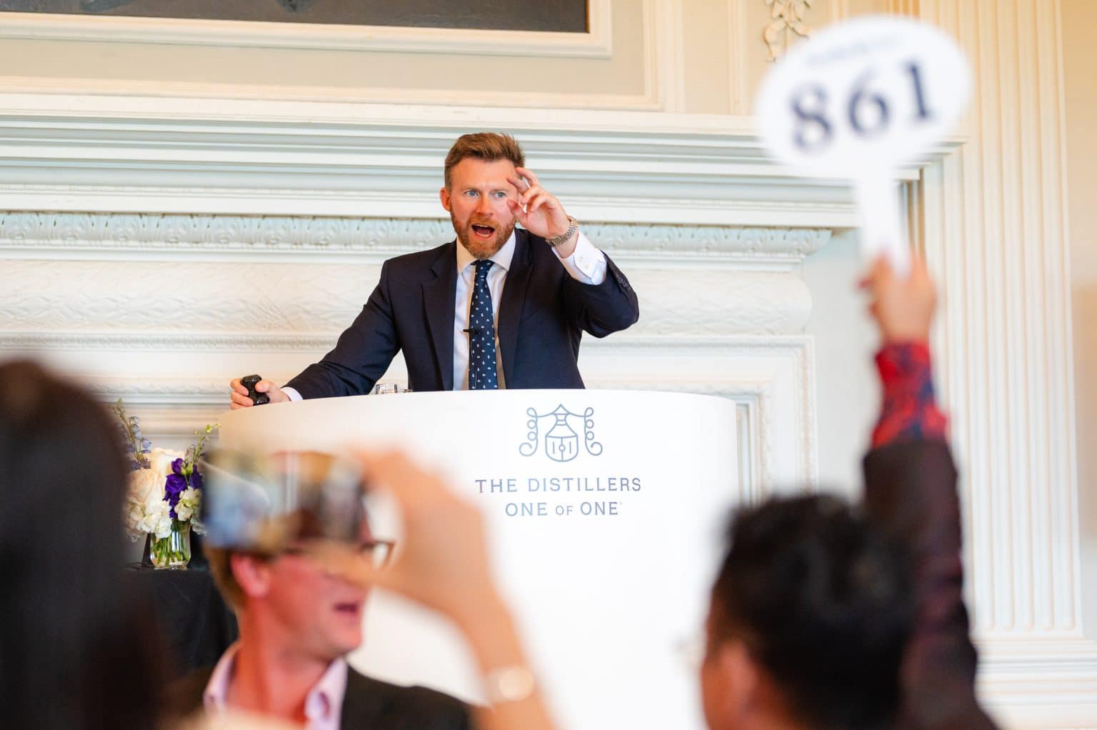 jonny fowle sothebys global head of spirits fielding bids at the distillers one of one auction at hopetoun house 10 october 2025