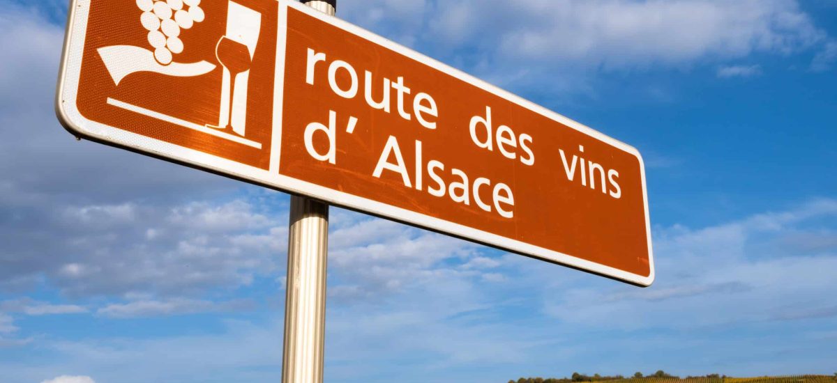 a sign and a symbol of route des vins in alsace, france. english translation: wine route of alsace